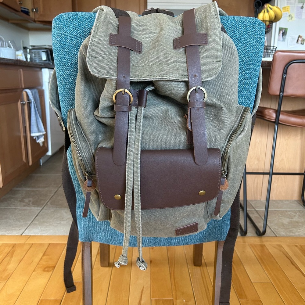 Canvas Drawstring Backpack With Brown Leather Trim - image 1
